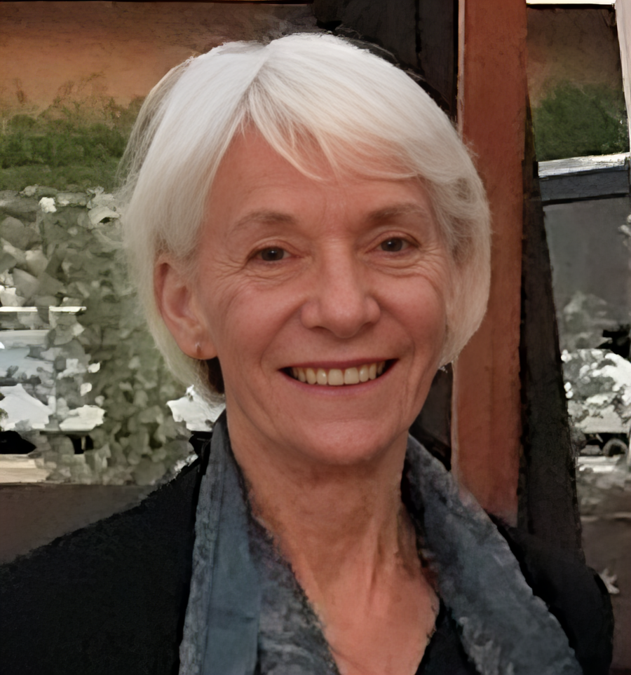 A photo of Beverley Henry. It shows a white woman with grey hair wearing a black jacket.
