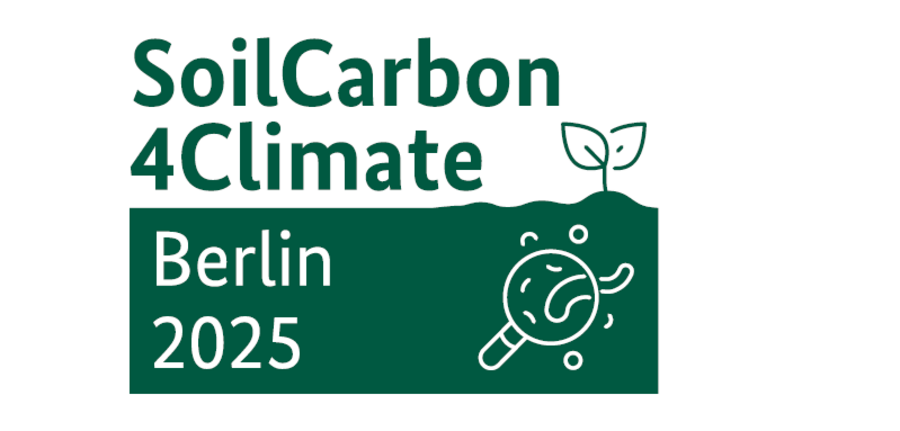 Logo of the “SoilCarbon4Climate” Conference. The upper half displays the title in bold, dark green letters on a white background. The lower half shows a stylized dark green soil cross-section. On the left, “Berlin 2025” is written in white within the soil. On the right, a single plant grows upward, while a white magnifying glass below it reveals a worm and various other soil organisms.